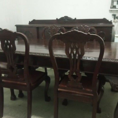 Antique dining table with 6 Lion chairs used, moderate condition