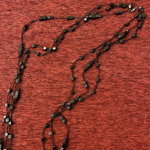Long necklace used, black with diamond-like beads
