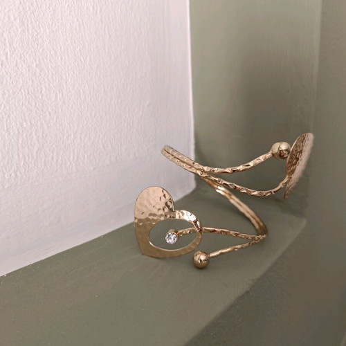 Cuff bracelet used with 2 gold-tone hearts