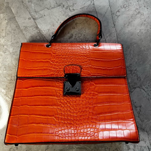Orange shoulder bag like new made of sturdy material