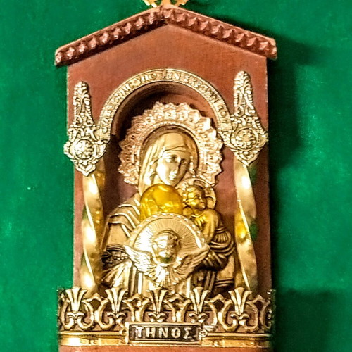 Vintage illuminated icon of Virgin Mary and Christ Child with lamp