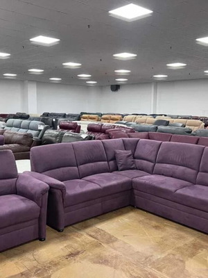 Purple fabric corner sofa with sleep function and armchair new