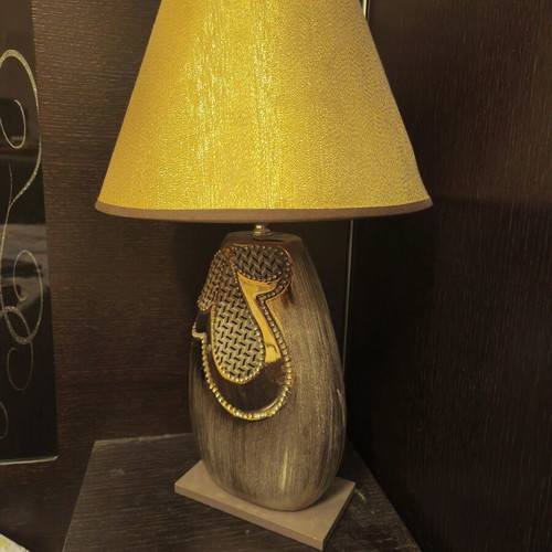 Table lamp used with switch in golden shade