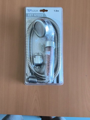 Shower set new, includes handset, hose, and mounting base