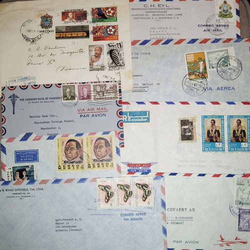 Collection of envelopes and stamps from around the world, new