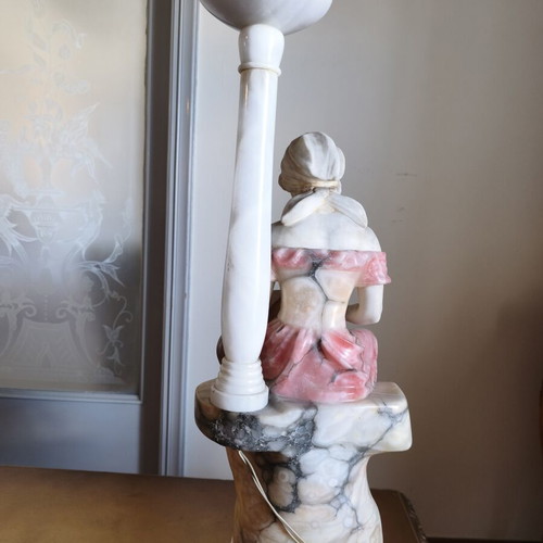 Statue of a woman playing a lute