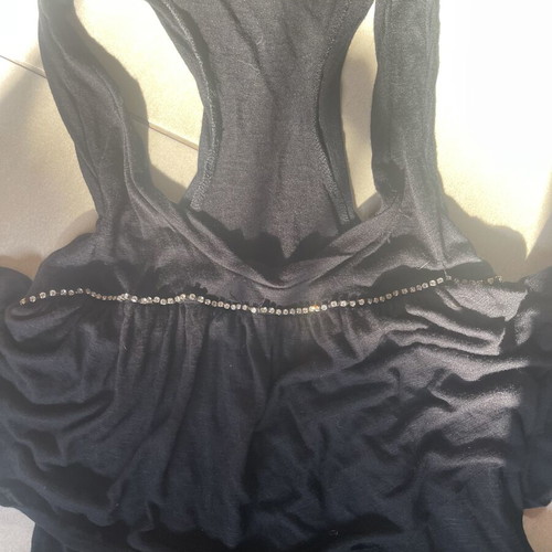 Black sleeveless blouse with ruffles and sporty back like new, size M