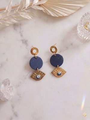 Polymer clay earrings with gold leaf and evil eye