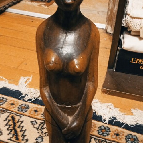 Handmade African wooden sculpture of standing female figure