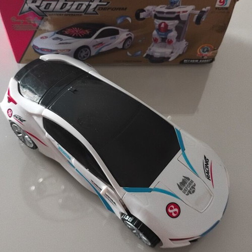 Robot car used with sounds and lights, transforms from car to robot