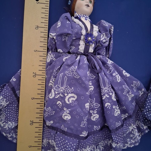 Vintage Slavic doll with porcelain head and fabric body