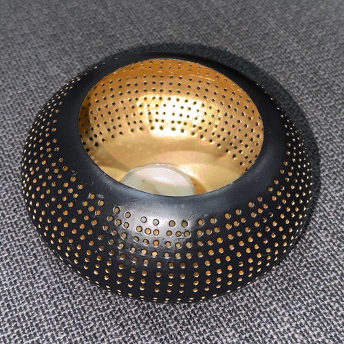 Metal tealight candle holder used black-gold with perforated design