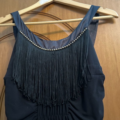 Evening dress used with satin details and fringes