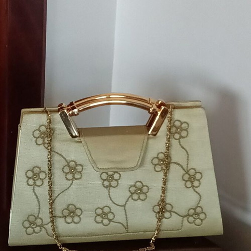 Small gold handbag with handle and long chain, like new