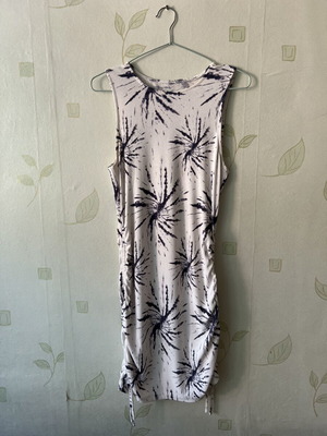 White elastic dress with unique design and side ties, like new, sizes S/M