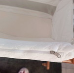 Vintage wooden baby cot with used Greco Strom mattress