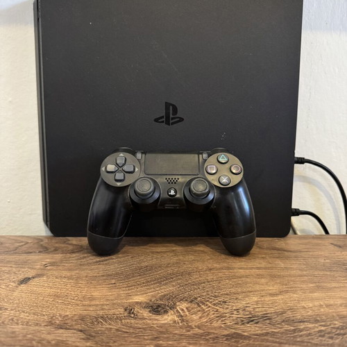 Sony PlayStation 4 console with one controller