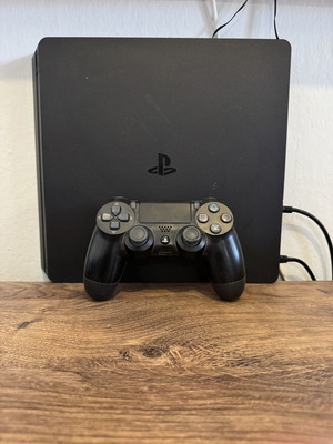 Sony PlayStation 4 console with one controller
