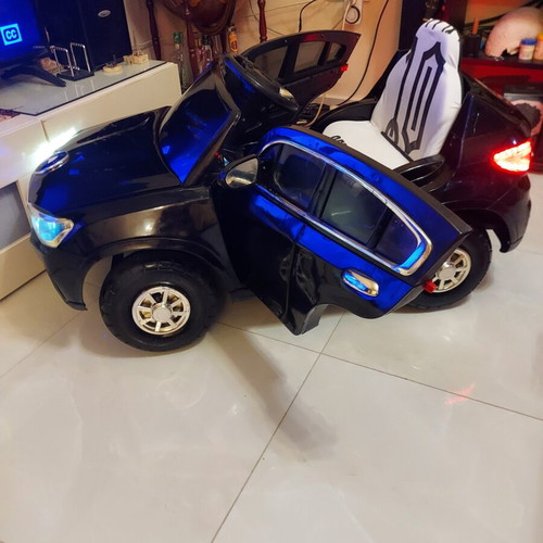 BMW X6 electric ride-on car like new with remote control and LED lights
