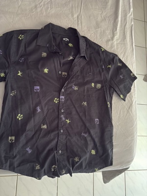 Billabong shirt black with designs, used, size S but fits medium