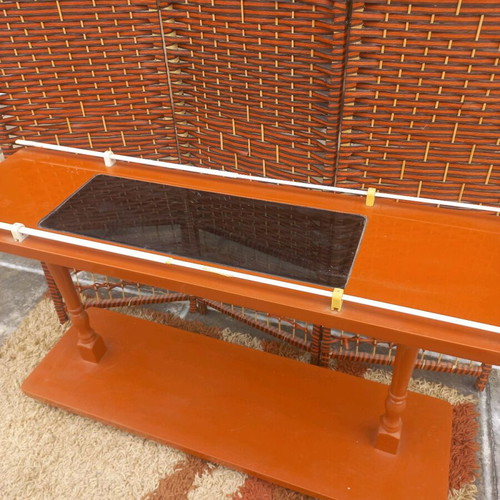 Small wheeled bar used with glass top and storage shelf