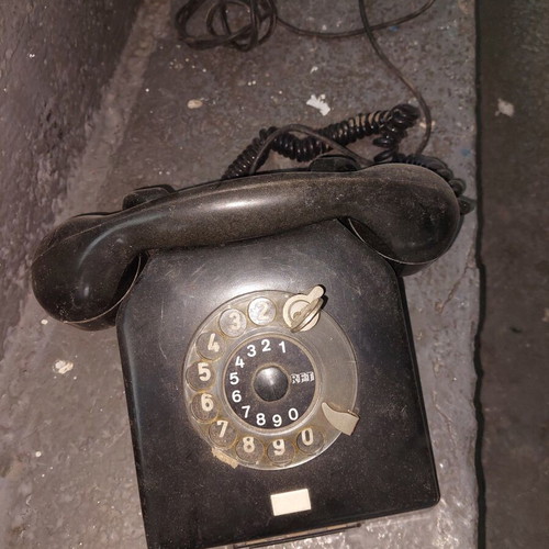 Retro telephone used, antique decoration, black wired