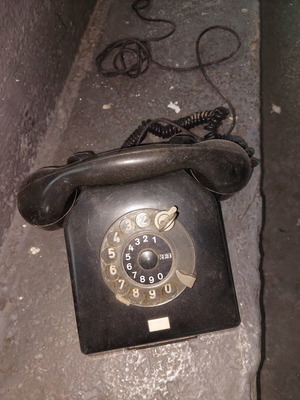 Retro telephone used, antique decoration, black wired
