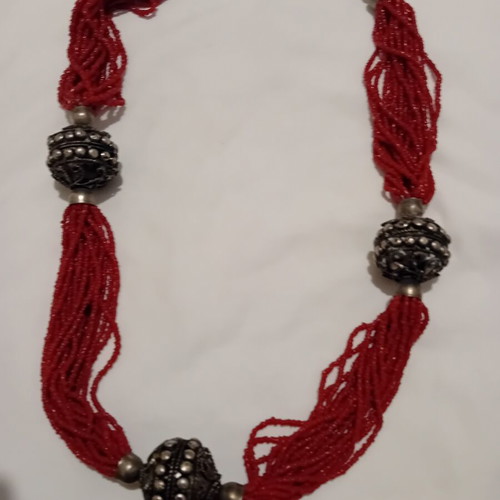 Red multistrand necklace with silver beads used