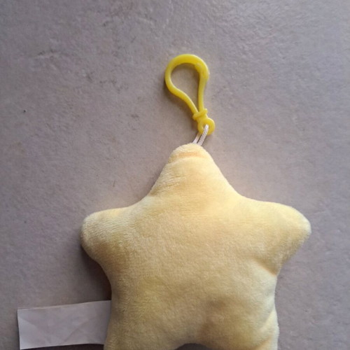 Star bath keychain like new, yellow with tongue