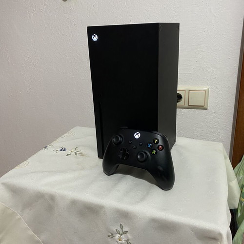 Xbox Series X console used with black wireless controller