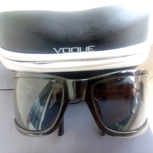 Vogue sunglasses used, black with scratch on lens