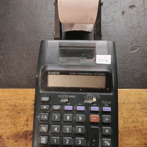 Casio calculator with paper used, battery operated