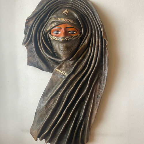 Leather wall mask like new, female face from Tunisia