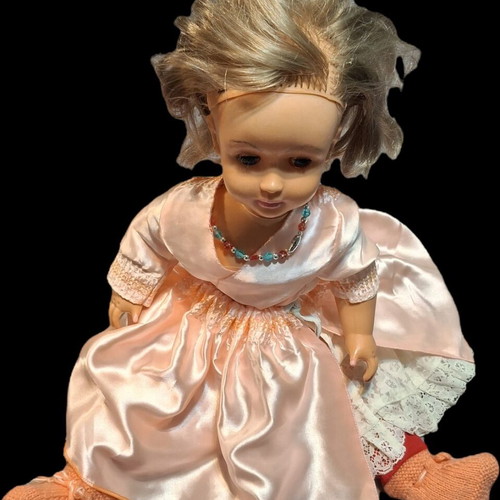 Vintage doll used with pink satin dress and knitted boots