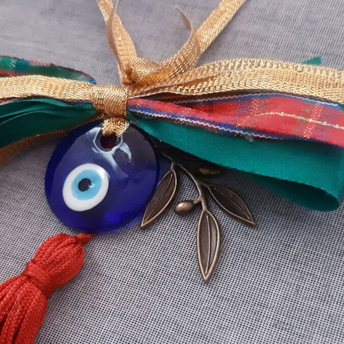 Glass eye charm with bronze olive branch and silk tassel, handmade