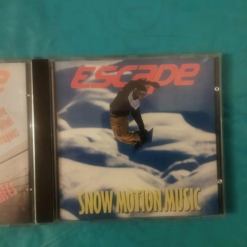 Escape Hot City Hits and Snow Motion Music CDs like new
