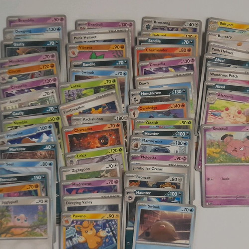 Pokémon lot used with 53 cards, 65 energy cards and 62 sleeves