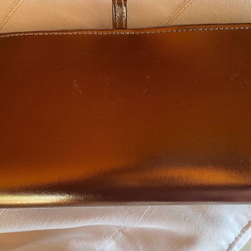 Evening hand bag like new with romantic lace decoration and copper tone