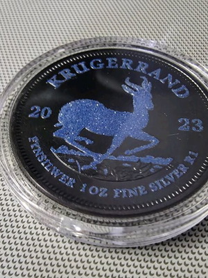 Krugerrand coin 1 oz new, pure silver with blue sapphire