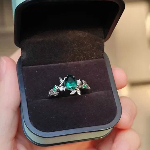 14K White Gold Engagement Ring with Emerald and Moissanite