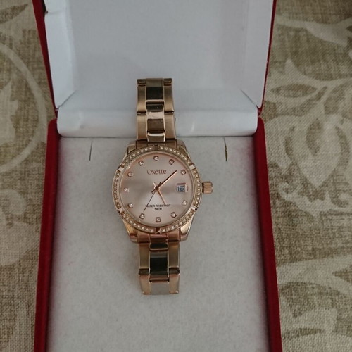 Oxette women's waterproof quartz watch with pink gold stainless steel bracelet and rhinestone bezel like new