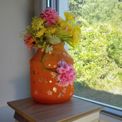 Handmade translucent orange vase with silver flowers