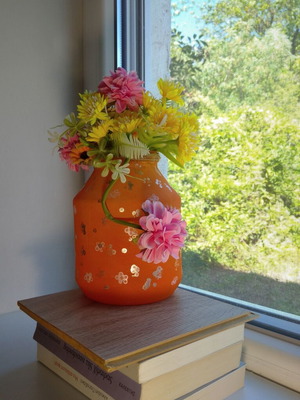Handmade translucent orange vase with silver flowers