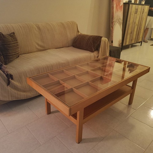 Wooden coffee table with display frame and lower shelf