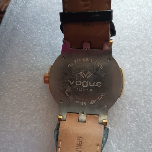 Vogue watch used with white dial and black leather strap