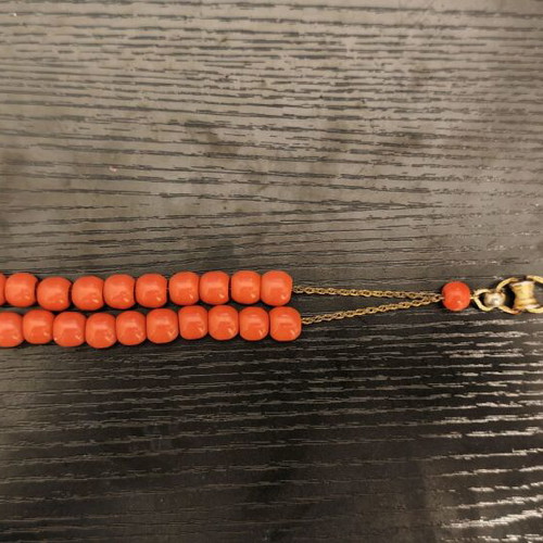Worry beads used with orange beads and metal chain