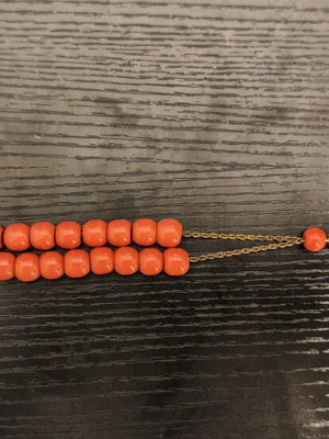 Worry beads used with orange beads and metal chain