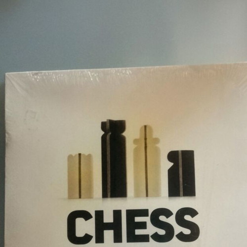 Chess game new, plastic laminated board for beginners