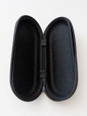 Black hard-shell glasses case with zip closure