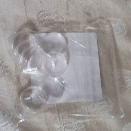 Coin holders new, 20 plastic with 4 cm radius and 9 with 2 cm radius